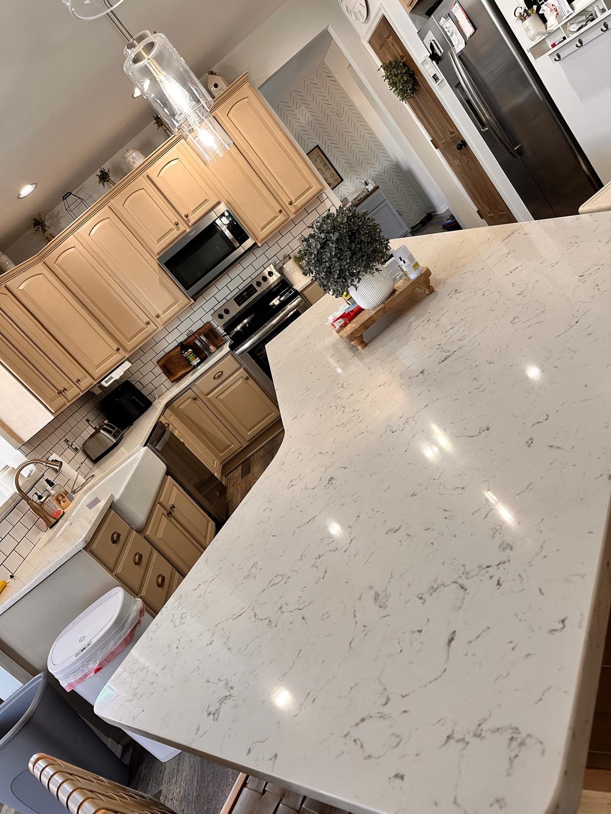 Kitchen cleaned by Dyment Cleaning Service: quartz counter and white subway tile left streak-free